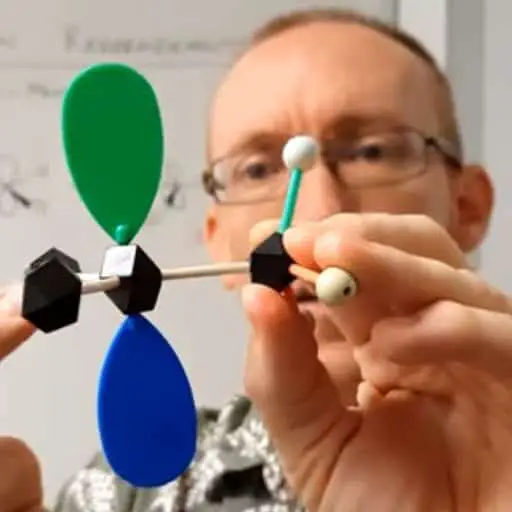 Mark Coster holding molecular model